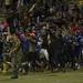 Pioneer fans rush the field after defeating Skyline 50-0 on Friday. Daniel Brenner I AnnArbor.com
